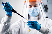 Researcher pipetting a hazardous sample