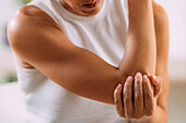 Woman with painful elbow