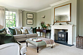 Classic living room with upholstered furniture and a wood stove