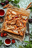 Sheet cake with apples and plums