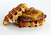A waffle burger with bacon