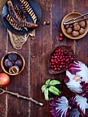 Flat lay seasonal vegetables and fruits, healthy vegetarian ingredients on a wooden background