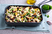 Vegan triplets-potato casserole with fried soy snails, mushrooms and peas