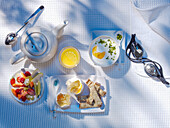 Breakfast with Greek yoghurt, egg, bread, fruit and tea next to a pair of goggles