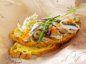 Tartine with anchovies and onions
