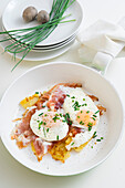Fried eggs with fried potatoes and bacon