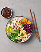 Vietnamese noodle bowl with chicken breast fillet