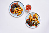 Vegetable meatballs with curry ketchup and potato wedges