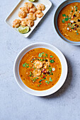 Red curry coconut soup with smoked tofu and prawns