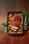 Roasted pork belly with beans and pistou