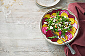 Colourful beetroot carpaccio with goat's cheese