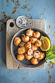 Pettole (deep-fried dough balls, Apulia, Italy) with paprika and fennel