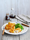 Fish fingers with peas and potatoes