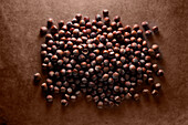 Hazelnuts on a brown background