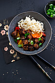Crispy sesame tofu vegetable pan with Mie noodles, vegan