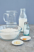 Ingredients for vegan pancakes - flour, oat drink, rock salt, turmeric