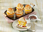 Pumpkin muffins with cheesecake topping and caramel sauce