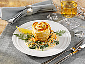 Puff pastry salmon snails on spinach for Christmas