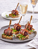 Bacon wrapped dates with goat cheese and pecans