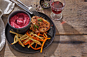 Pork steak with beet and sour cream dip with white and sweet potato fries