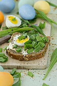 Buttered bread with ribwort and hard-boiled egg