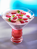 Raspberry mousse with mint leaves