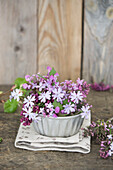 Lilac blossoms in vintage tin bowl