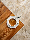 A cup of Americano on a wooden table