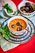 Bowl of lentil soup with meatballs