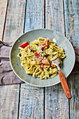 Tagliatelle with herb sour cream and tomatoes