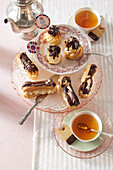 Passion fruit cream puffs with chocolate hat for teatime
