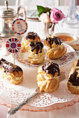 Passion fruit cream puffs with chocolate hat for teatime