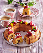 Wreath cake with caramelised plums