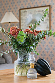 Bouquet of flowers in glass vase on coffee table