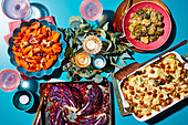 Various vegetable side dishes: Parmesan Brussels sprouts, flower cola casserole, roasted red cabbage, and carrot vegetables