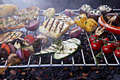 Grilled vegetables and halloumi cheese on a grill rack