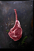 Raw tomahawk steak