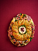 Hearty yeast wreath with cheese and spicy cranberry jam