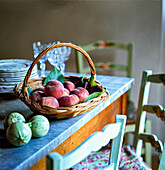 Peaches in a basket on a kitchen table