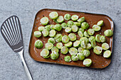 Prepare Brussels sprouts for the oven with oil and spices