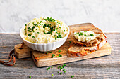 Bavarian potato cheese spread with bread slices