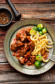 Bavarian game stew with juniper cream, Spätzle (Swabian egg noodles) and Brussels sprouts