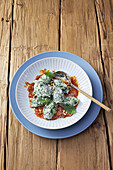Malfatti (spinach-ricotta dumplings) with tomato sauce