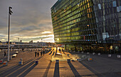 A sunset view of the Harpa Concert Hall, beside the Old Harbour, Reykjavik, Iceland, Polar Regions