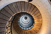 Spiral staircase from below in the Eckmuhl Lighthouse in Brittany, France, Europe