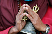 Buddhist monk (lama) in traditional robes holding ritual attributes of Buddhism, rosary, vajra, bell, Pema Osel Ling Monastery, Kathmandu, Nepal, Asia
