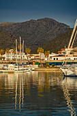 View of sunrise reflecting on yachts in Port de Pollenca Marina, Port de Pollenca, Majorca, Balearic Islands, Spain, Mediterranean, Europe