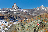 Hikers on Gornergrat, Matterhorn Peak, 4478m, Zermatt, Valais, Swiss Alps, Switzerland, Europe