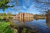 The moat of the brick built 15th century Herstmonceux Castle, East Sussex, England, United Kingdom, Europe