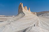 Woman photographing Bozzhira Canyon, Ustyurt plateau, Mangystau, Kazakhstan, Central Asia, Asia